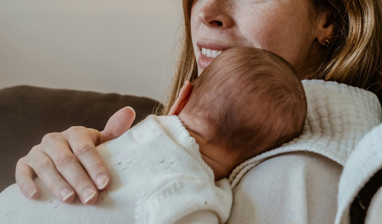 Mother holding newborn baby